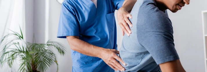 A chiropractor performing an upper back